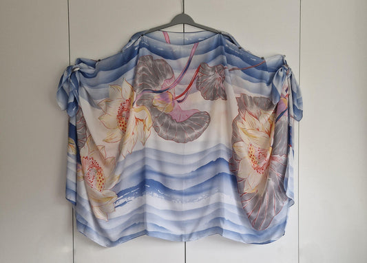 Handmade Boho-style multi-wear kaftan. Coloured with a lotus flower and blue waves coloured robe, with botanical, made from a soft cotton-polyester blend