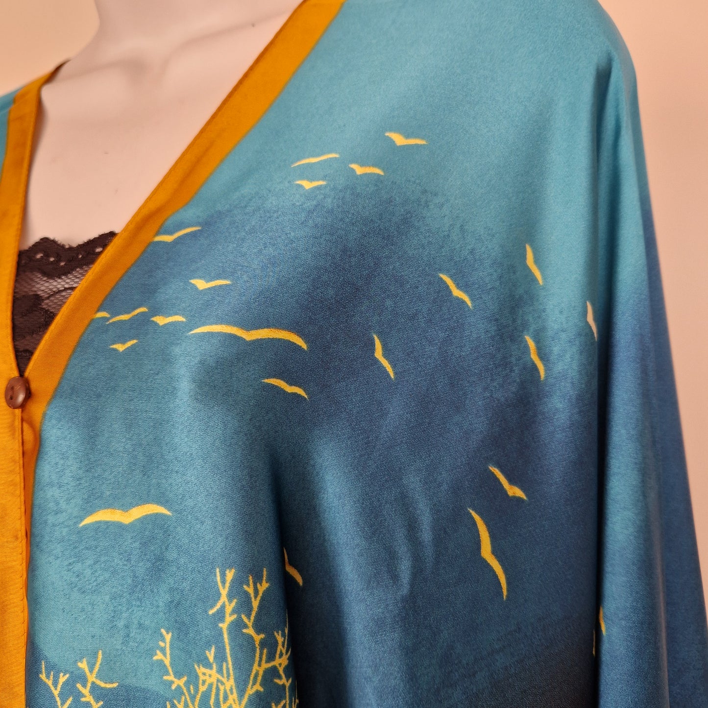 Handmade Boho-style multi-wear kaftan and a blue robe with a golden border, and with botanical, made from a soft cotton-polyester blend