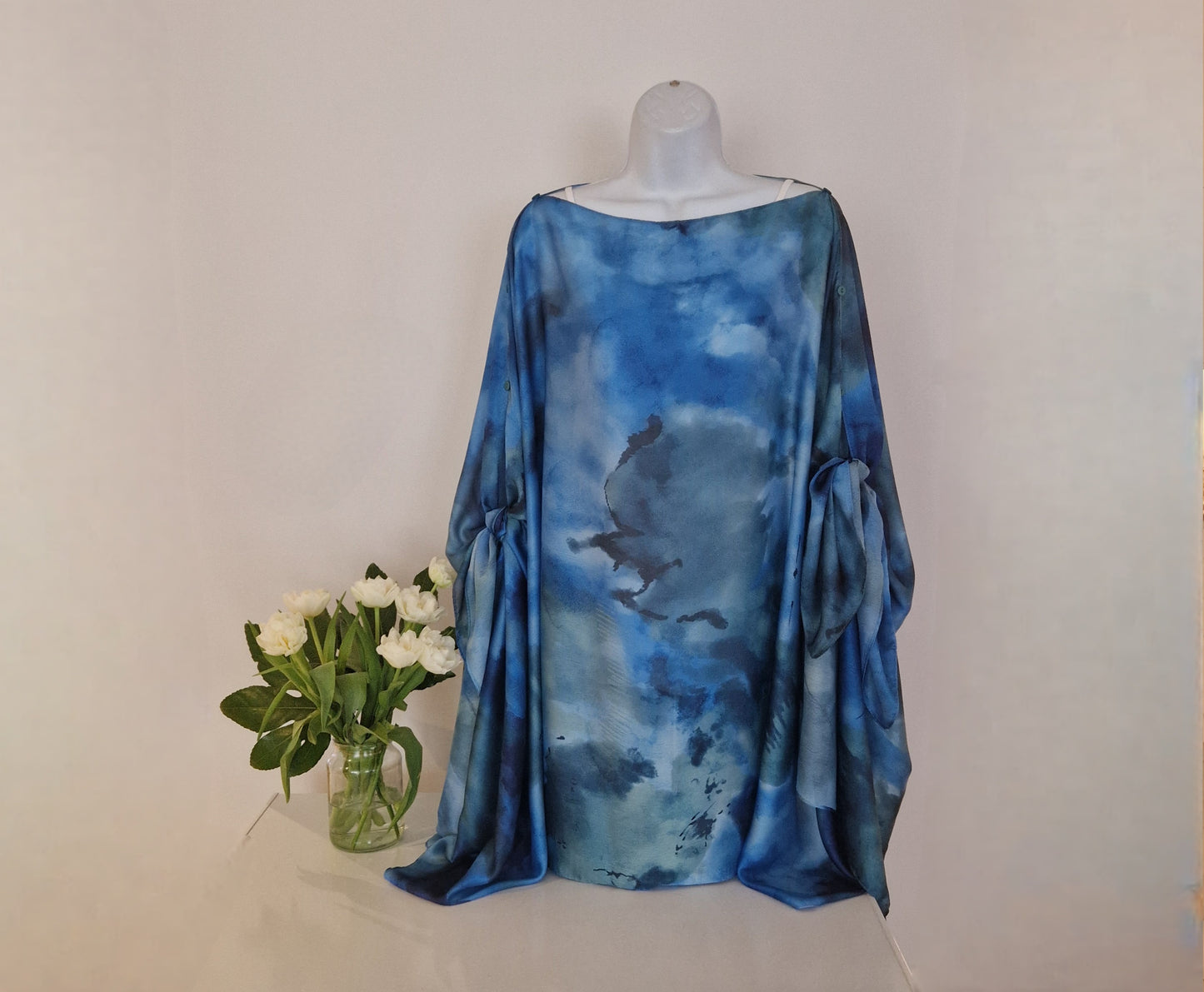 Boho-style multi-wear kaftan and robe in turquoise with botanical cherry blossom print, made from a soft cotton-polyester blend