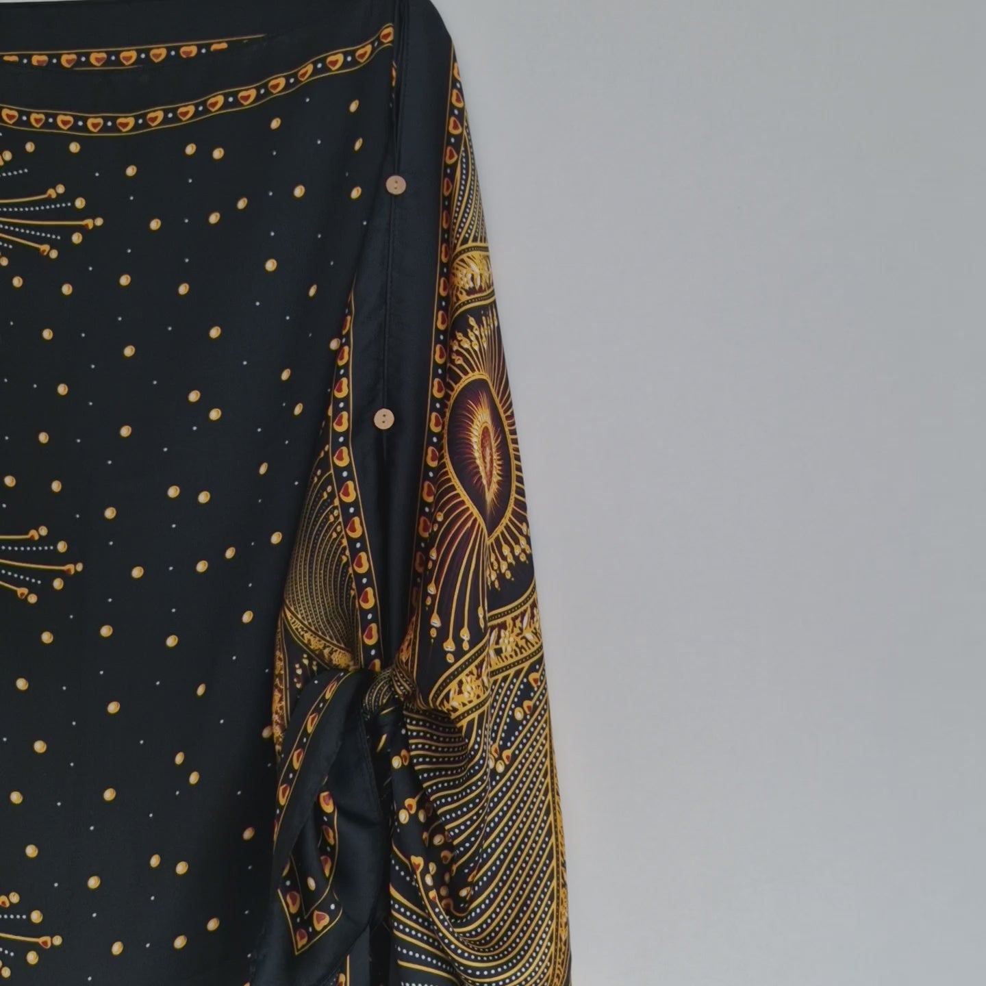 Handmade Boho-style multi-wear kaftan and a multi coloured warm coloured robe, with botanical, made from a soft cotton-polyester blend